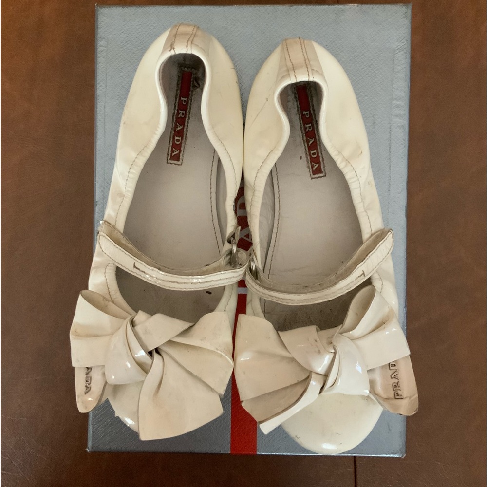 Little girls white authentic Prada Mary Janes with white bow